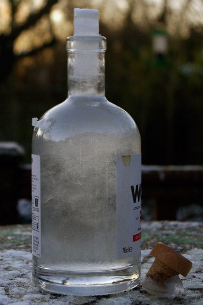 Bottle of ice with expanded column emerging